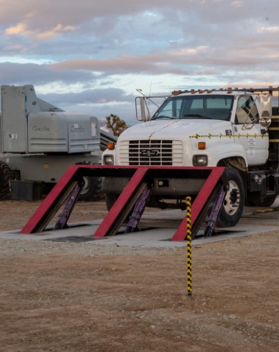 Out of control truck getting stopped by an anti-vehicle barrier when it crashes onto it